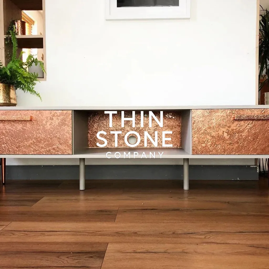 Metallic Copper stone veneer on a cabinet