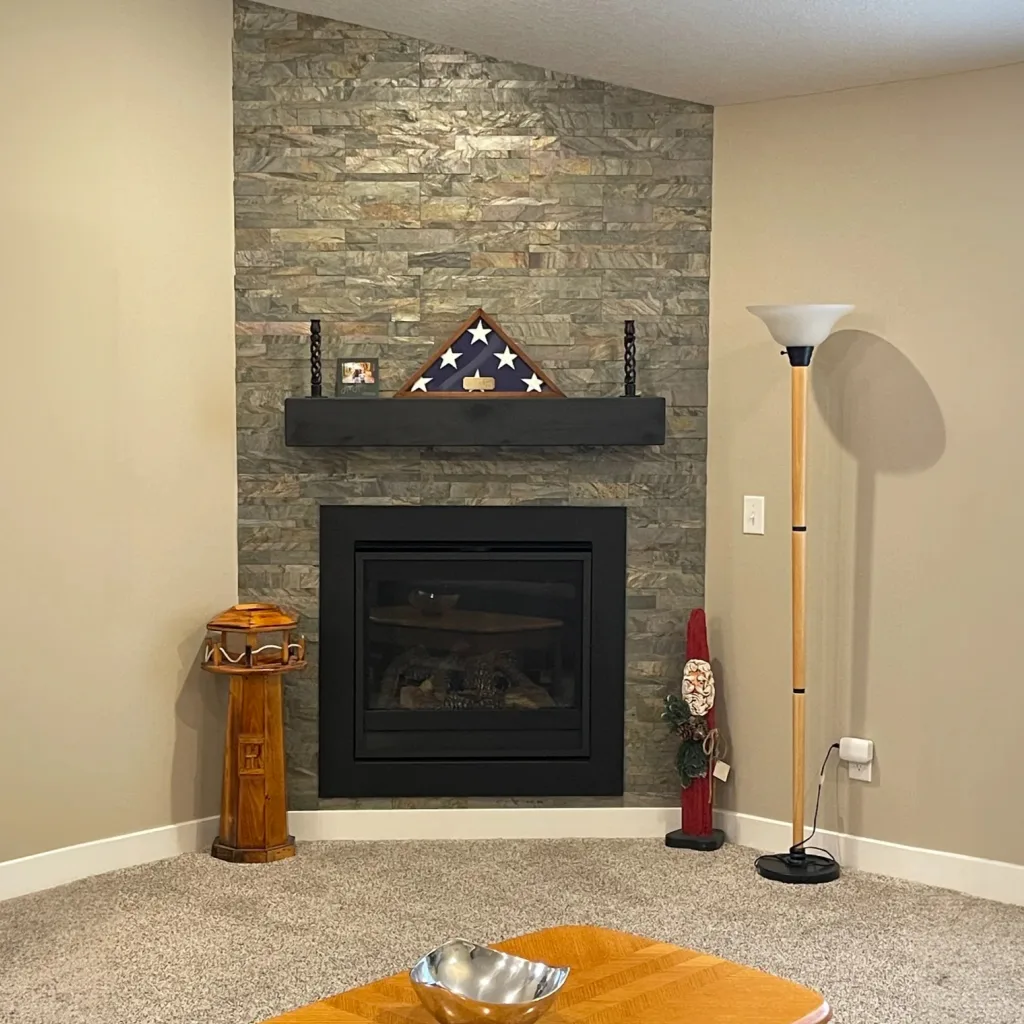 Burning forest peel and stick 3D wall panel installed on fireplace